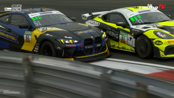 Two race cars squeeze together on track in a close duel; #51 blue-yellow BMW and #31 white-yellow car with sponsor livery, RacingTV logo top-right.